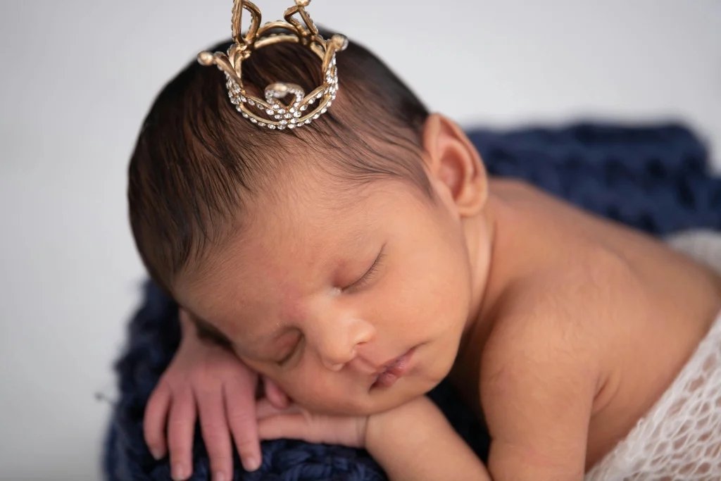 A little baby girl wearing crown like a queen 