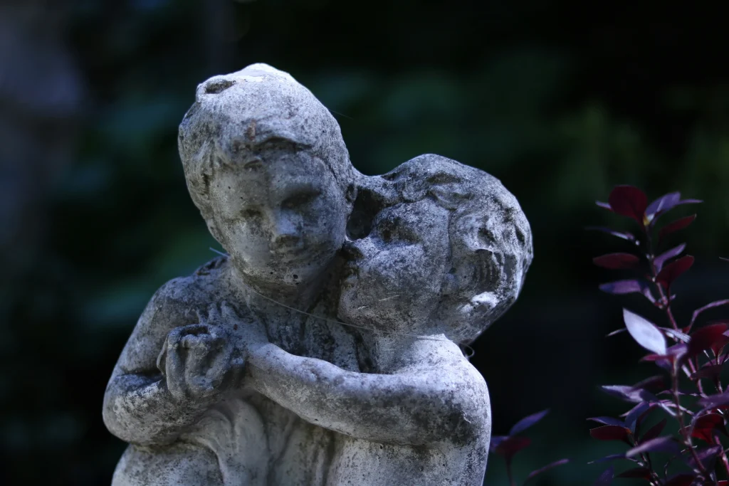 Mother showing mercy with a child statue