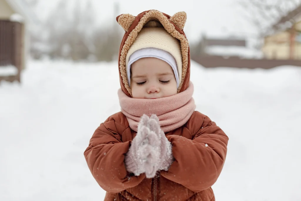 little child enjoying winter
