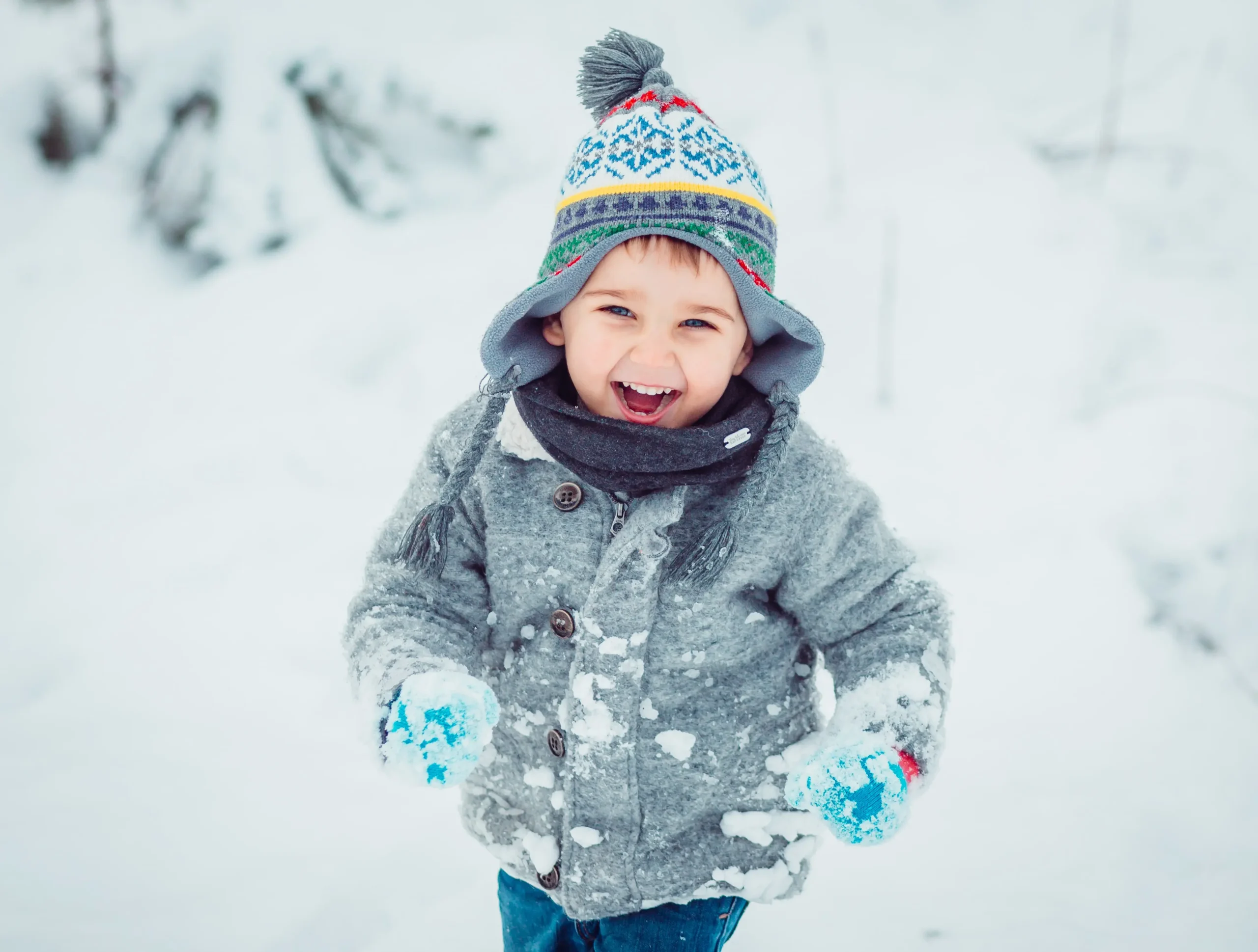 little baby boy running in snow
